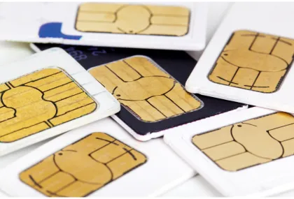 A scattered pile of various mobile SIM cards with gold electronic chips visible, representing different cellular providers and data options.