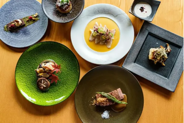 A spread of gourmet Japanese fusion dishes from Itoh Dining by Nobu