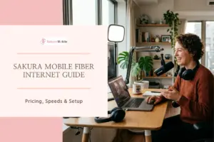 Woman live streaming and podcasting from a desk setup with a microphone and laptop in a bright city apartment.
