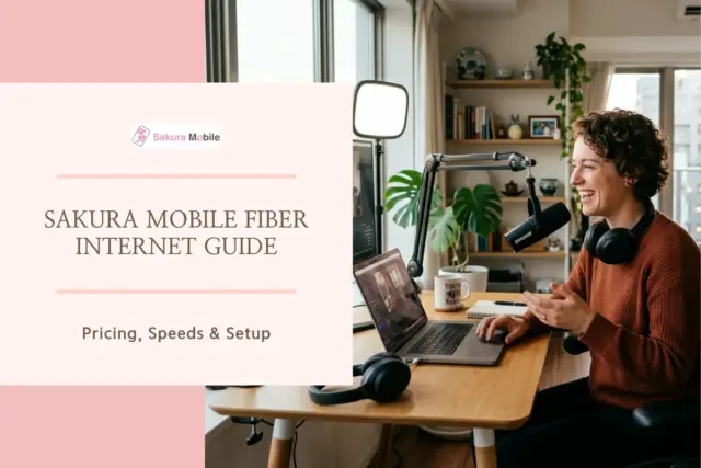 Woman live streaming and podcasting from a desk setup with a microphone and laptop in a bright city apartment.