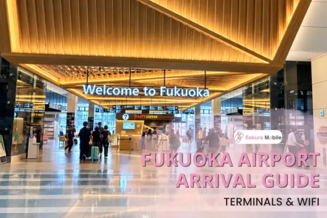 Travelers walk through the arrival hall at Fukuoka Airport under a large "Welcome to Fukuoka" sign.