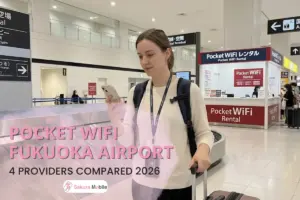 A tourist in Fukuoka Airport looking at her phone iwth a Pocket WiFi.